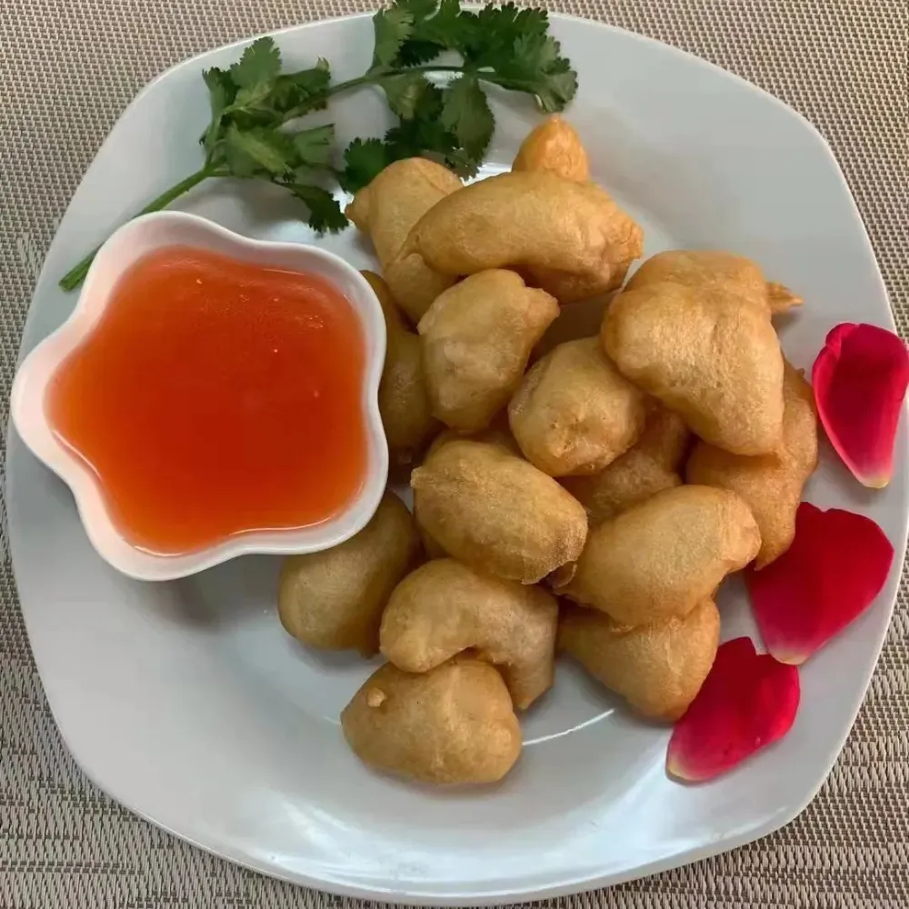 Fried chicken nuggets with sweet and sour sauce at Family Kitchen, an Chinese Restaurant in Brooklyn.