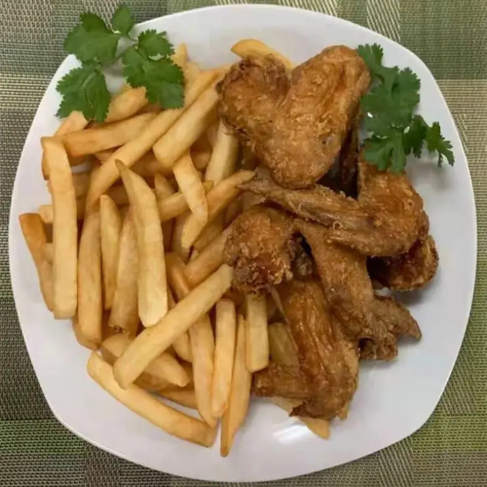 Fried chicken wings with fries at Family Kitchen, an Chinese Restaurant in Brooklyn.